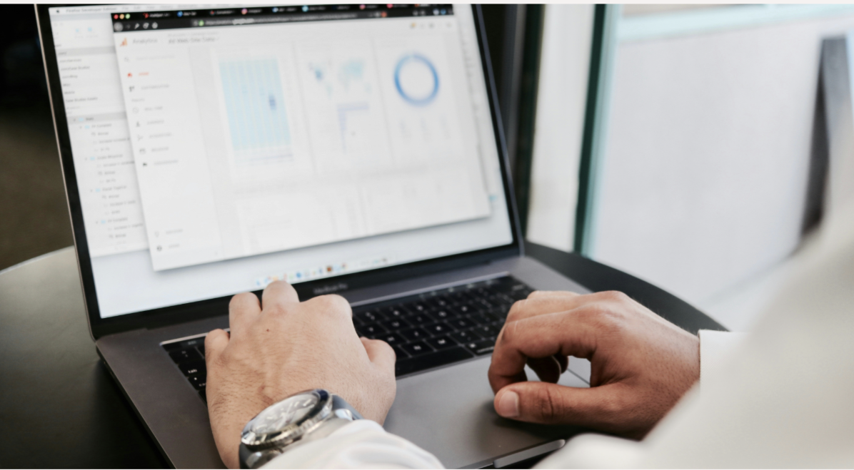 Person working on laptop with analytics